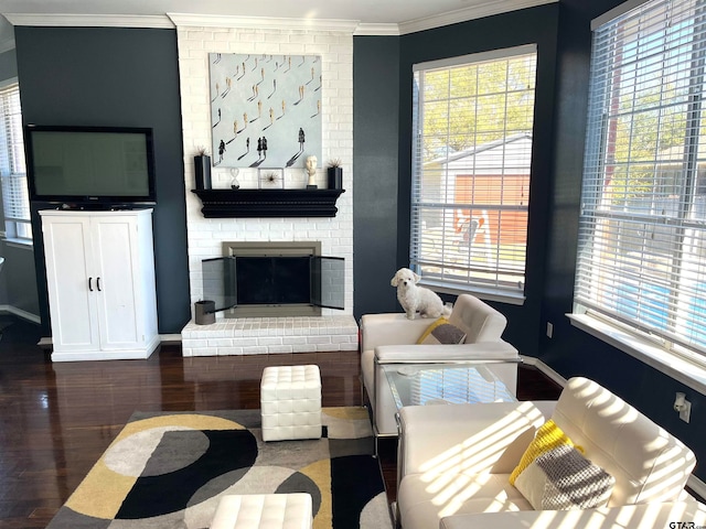 living room featuring dark hardwood / wood-style floors, a brick fireplace, and ornamental molding