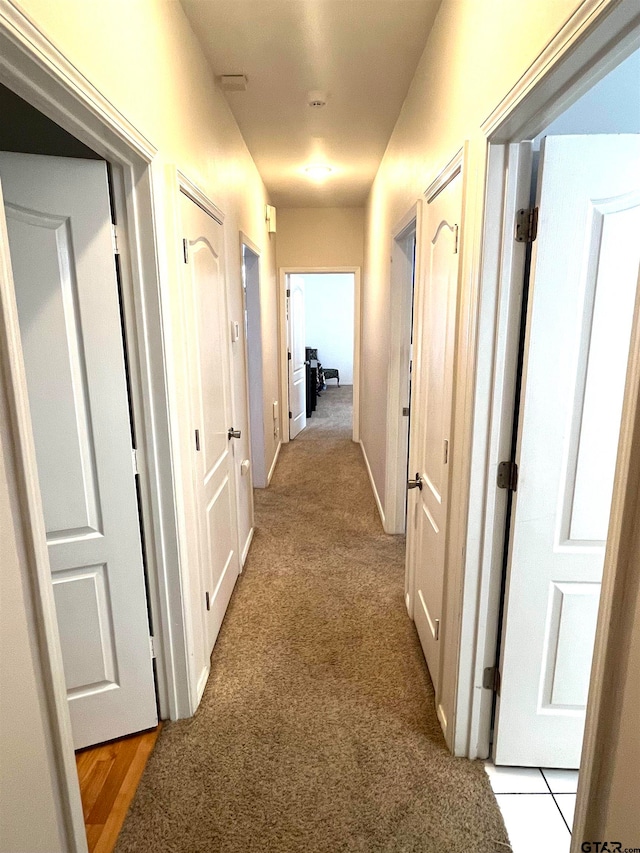 hallway with light carpet