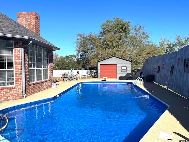 view of pool featuring a shed