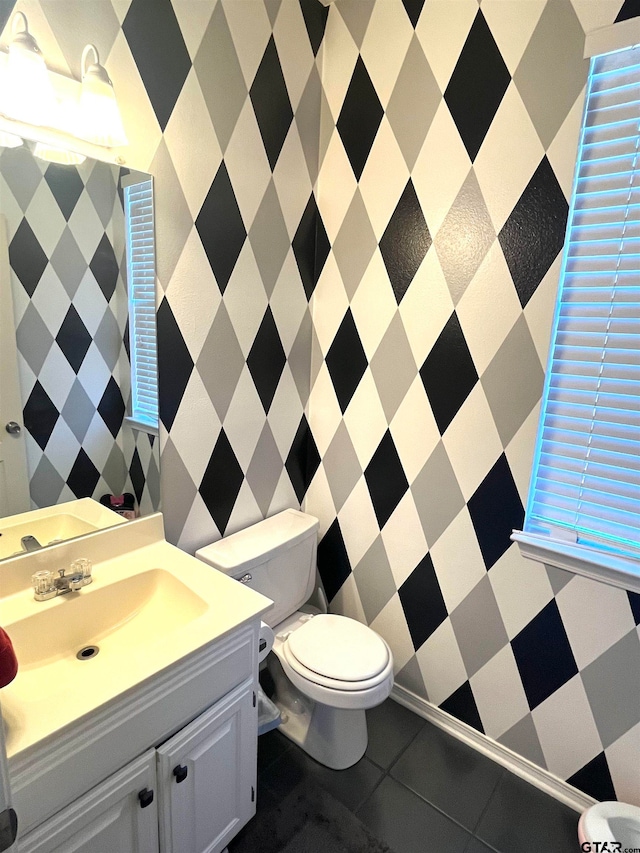 bathroom with tile patterned floors, vanity, and toilet