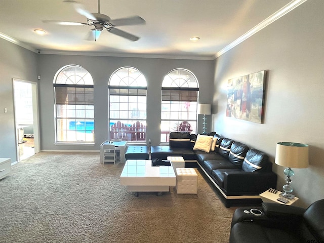 living room featuring carpet floors, ceiling fan, and crown molding