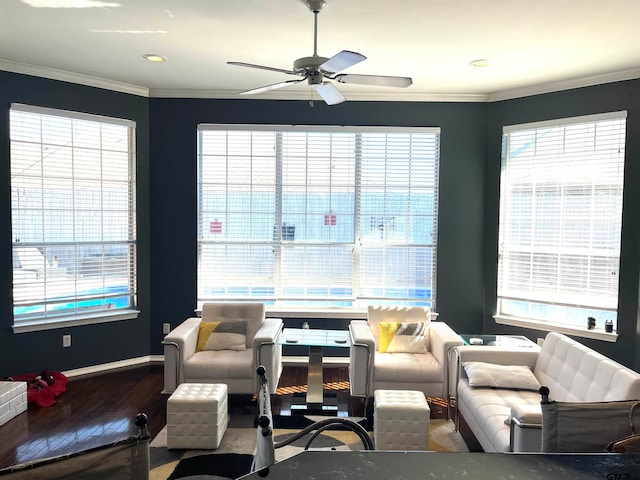 living room with crown molding, ceiling fan, and hardwood / wood-style flooring