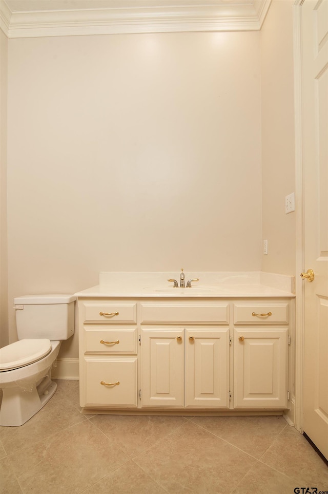 bathroom featuring tile patterned flooring, vanity, and toilet