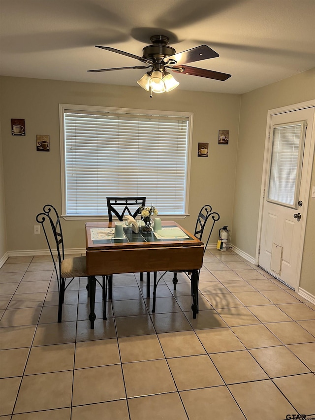 tiled dining room with ceiling fan