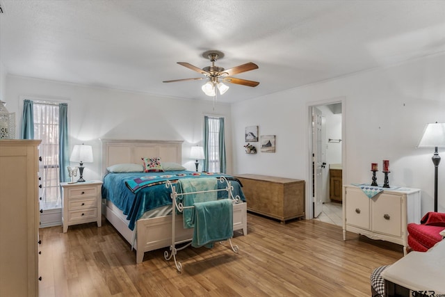 bedroom featuring light hardwood / wood-style floors and ceiling fan