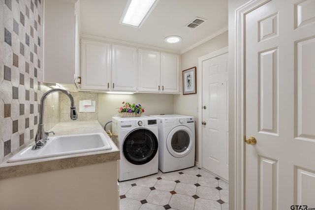 215 S Bay Dr, Bullard, TX 75757 - washroom with cabinet space, washer and clothes dryer, light floors, and crown molding