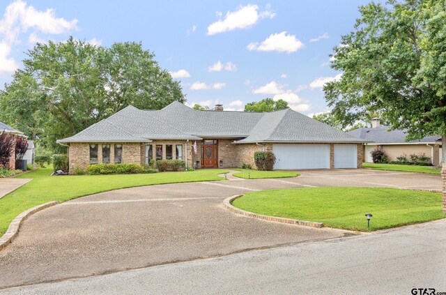 215 S Bay Dr, Bullard, TX 75757 - view of front facade with driveway, a garage, a front yard, a chimney, and brick siding
