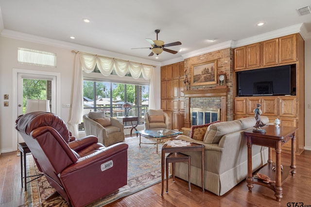 215 S Bay Dr, Bullard, TX 75757 - living room with ceiling fan, wood finished floors, crown molding, recessed lighting, and a fireplace