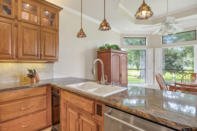 215 S Bay Dr, Bullard, TX 75757 - kitchen with crown molding, ceiling fan, tasteful backsplash, and brown cabinetry