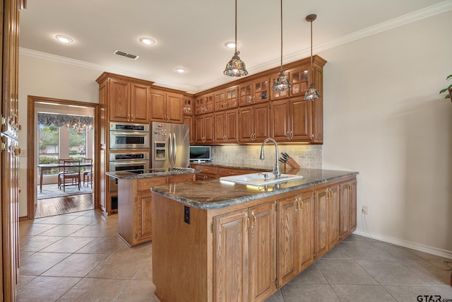 215 S Bay Dr, Bullard, TX 75757 - kitchen featuring appliances with stainless steel finishes, light tile patterned floors, ornamental molding, brown cabinetry, and recessed lighting
