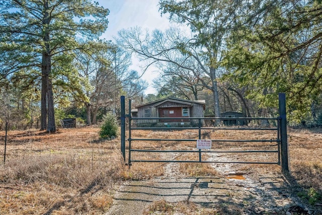 view of gate featuring fence