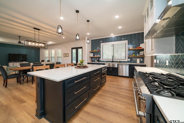 24579 Crk 4117, Frankston, TX 75763 - kitchen featuring stainless steel dishwasher, open shelves, wall chimney exhaust hood, white cabinets, and ceiling fan