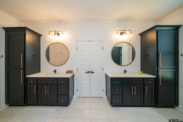 24579 Crk 4117, Frankston, TX 75763 - full bathroom featuring two vanities and baseboards