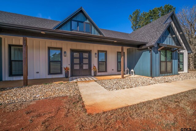 24579 Crk 4117, Frankston, TX 75763 - view of front of home featuring a shingled roof, a porch, and board and batten siding