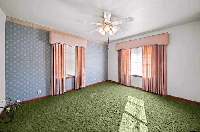 unfurnished room with carpet flooring and ceiling fan