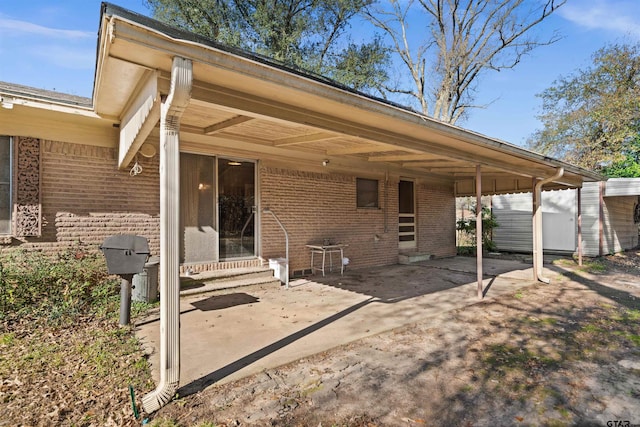 exterior space featuring a carport and a shed