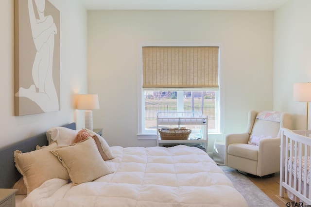 bedroom with light wood finished floors