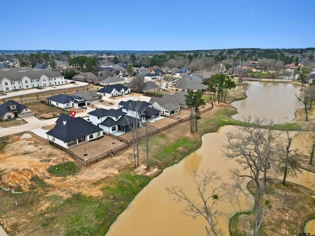 aerial view with a residential view and a water view