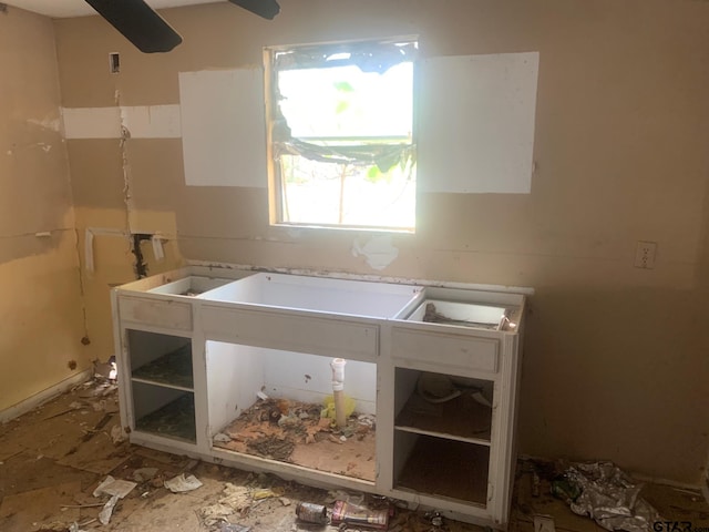 laundry room with ceiling fan