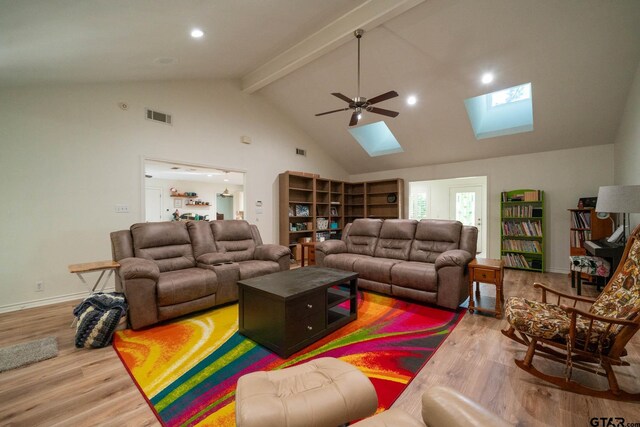 431 Gifford St, Rusk, TX 75785 - living room with a skylight, wood finished floors, high vaulted ceiling, beam ceiling, and a ceiling fan
