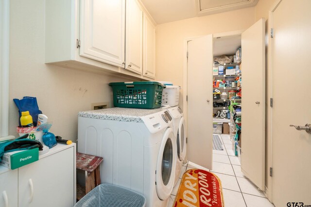 431 Gifford St, Rusk, TX 75785 - washroom featuring cabinet space, light tile patterned floors, and washing machine and dryer