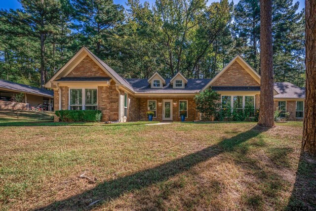431 Gifford St, Rusk, TX 75785 - view of front of home featuring brick siding and a front lawn