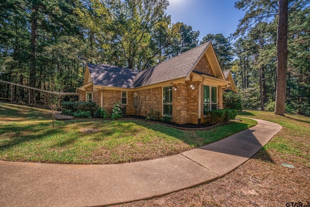 view of side of property featuring a yard