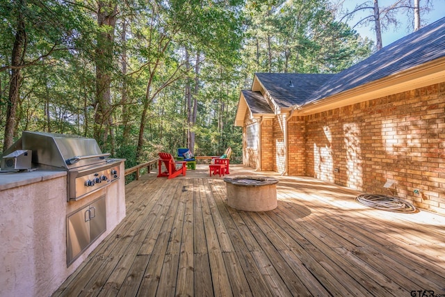 431 Gifford St, Rusk, TX 75785 - deck featuring an outdoor fire pit and an outdoor kitchen