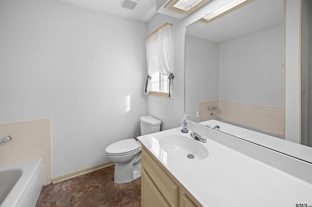 full bath with visible vents, toilet, vanity, baseboards, and a bath