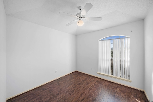 unfurnished room with baseboards, ceiling fan, a textured ceiling, and hardwood / wood-style floors