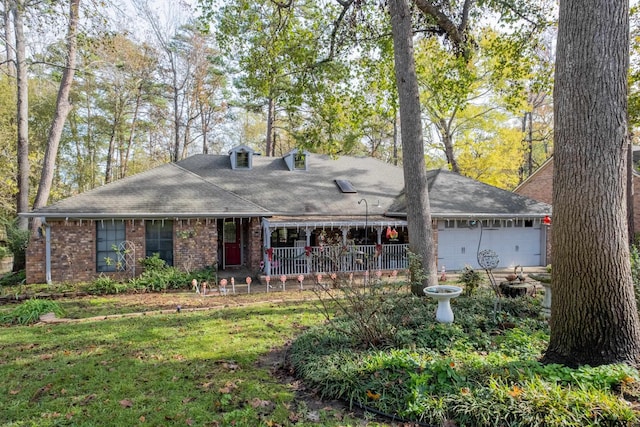 view of front facade with covered porch and a garage