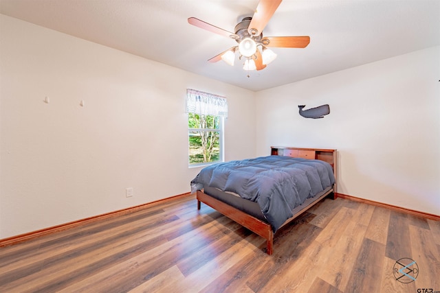 bedroom featuring ceiling fan and wood-type flooring