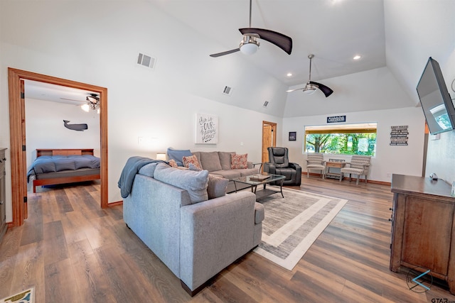 living room featuring ceiling fan, dark hardwood / wood-style flooring, and lofted ceiling