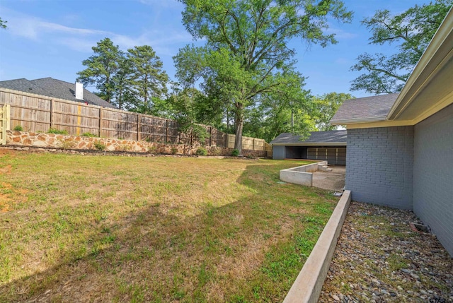 view of yard with a fenced backyard