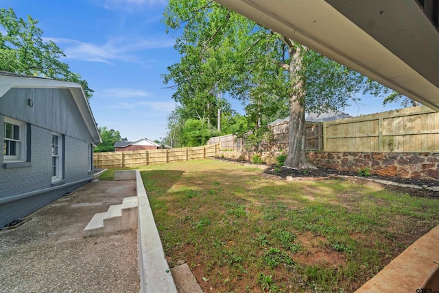 view of yard featuring a fenced backyard