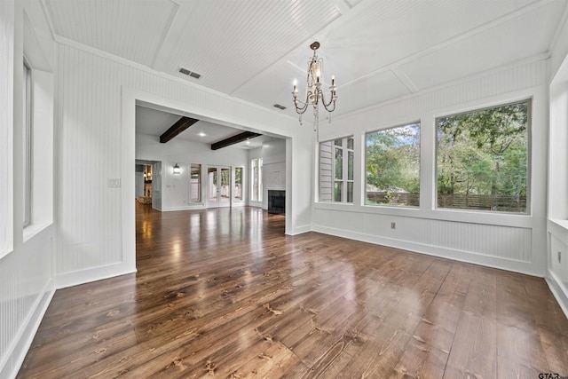 unfurnished living room featuring visible vents, beam ceiling, a notable chandelier, wood-type flooring, and a fireplace