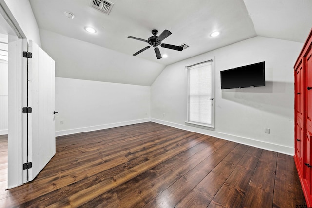 bonus room featuring visible vents, lofted ceiling, baseboards, and dark wood-style floors