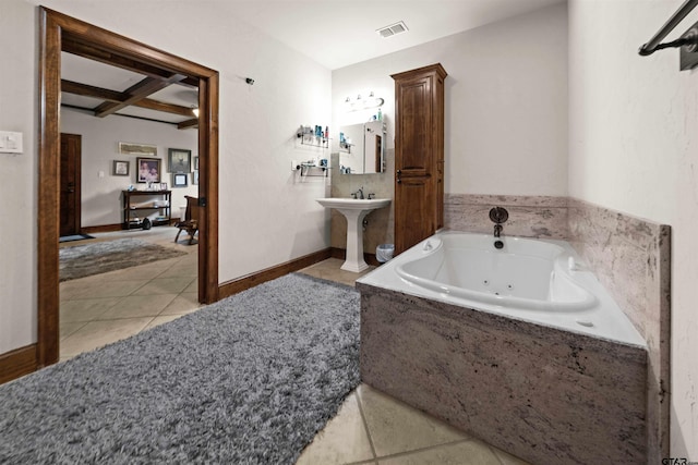 bathroom featuring coffered ceiling, sink, tile patterned flooring, tiled tub, and beam ceiling