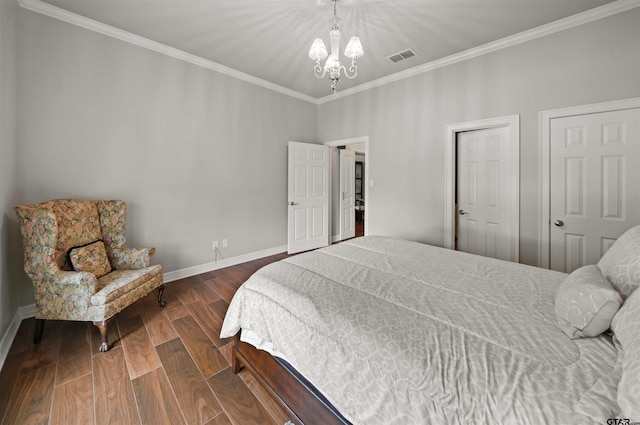 bedroom featuring ornamental molding and a chandelier