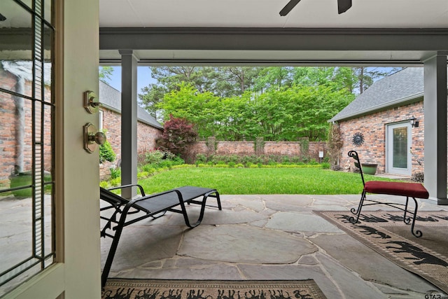 exterior space featuring ceiling fan