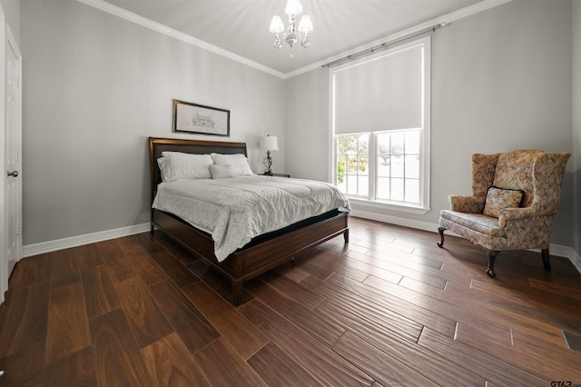 bedroom with ornamental molding, dark hardwood / wood-style flooring, and a notable chandelier