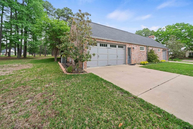 view of front of property featuring a garage, a front lawn, and central air condition unit