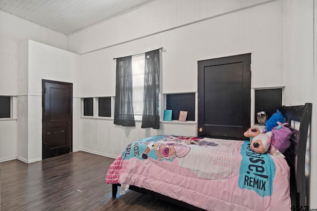 bedroom featuring dark hardwood / wood-style flooring