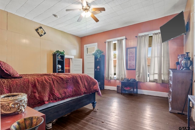 bedroom featuring ceiling fan and dark wood-type flooring