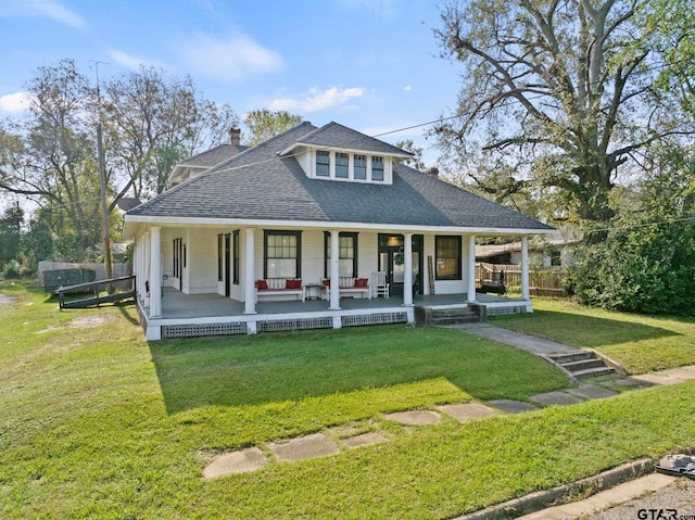 view of front of home featuring a porch and a front lawn