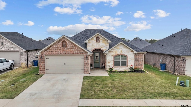 french country inspired facade with a garage and a front lawn