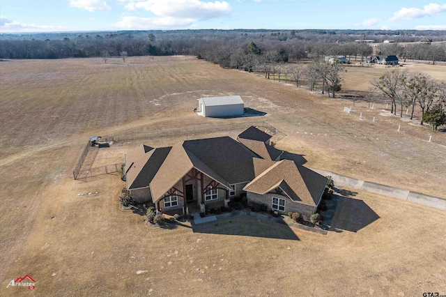 birds eye view of property with a rural view