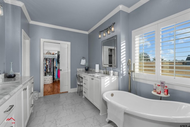 bathroom with vanity, a bath, and crown molding