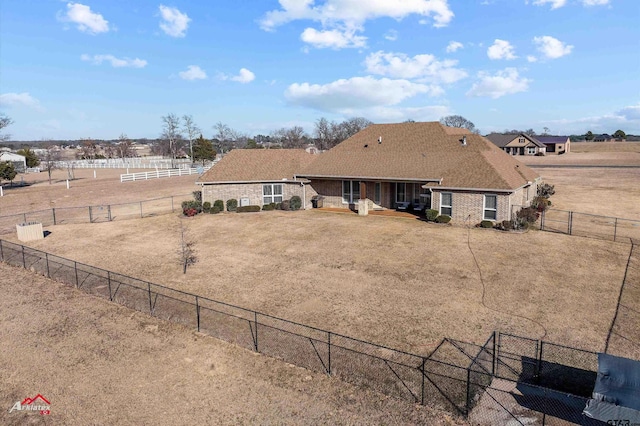 back of property with a rural view