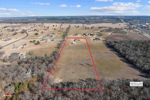 birds eye view of property featuring a rural view